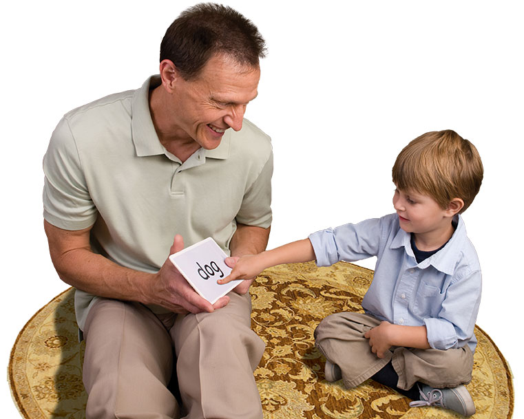Dr. Titzer playing word games with a child